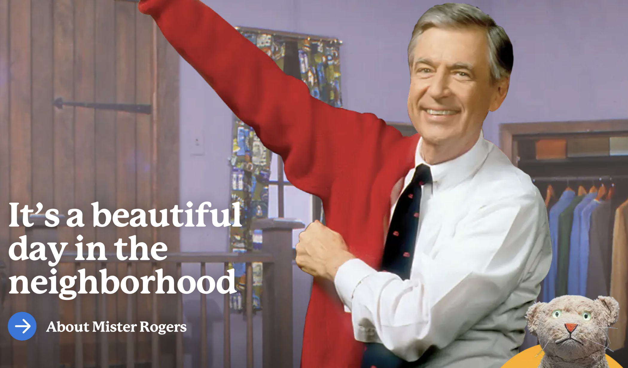 Text: "It's a beautiful day in the neighborhood" A man with puts on a red sweater with a small cat puppet in the bottom right.